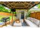 Charming outdoor living space featuring comfortable seating, a grill, and a TV, ideal for entertaining guests at 2681 Linnwood Se Dr, Smyrna, GA 30080
