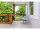Inviting porch featuring comfortable seating, neutral tiling, and a serene outdoor atmosphere at 2681 Linnwood Se Dr, Smyrna, GA 30080