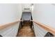 Modern stairway with wooden steps and metal railing, leading to additional living spaces in the home at 2681 Linnwood Se Dr, Smyrna, GA 30080