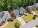 Beautiful home with manicured lawn; a top-down perspective showcases the home's position on the street at 320 Rossiter Rdg, Alpharetta, GA 30022
