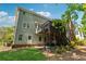 Back of house showing a deck, walkout basement and well maintained backyard at 320 Rossiter Rdg, Alpharetta, GA 30022