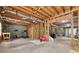 Unfinished basement with utilities and framed walls, ready for customization and storage solutions at 320 Rossiter Rdg, Alpharetta, GA 30022