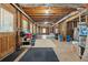 Spacious unfinished basement featuring exposed beams, natural light, and ample storage space at 320 Rossiter Rdg, Alpharetta, GA 30022
