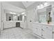 Bright, spacious bathroom with large mirrors, double sinks, and ample counter space at 320 Rossiter Rdg, Alpharetta, GA 30022