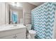 Bathroom featuring shower with white and blue curtain and white vanity at 320 Rossiter Rdg, Alpharetta, GA 30022