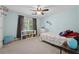 Carpeted bedroom with blue accent wall and great natural light at 320 Rossiter Rdg, Alpharetta, GA 30022