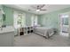 Bedroom featuring light green walls, window views, and carpeted floors at 320 Rossiter Rdg, Alpharetta, GA 30022