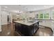Gourmet kitchen featuring an island with a cooktop, and lots of natural light at 320 Rossiter Rdg, Alpharetta, GA 30022