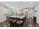 Gourmet kitchen featuring an island with seating, stainless steel appliances, and granite countertops at 320 Rossiter Rdg, Alpharetta, GA 30022