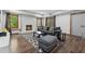 Cozy living room with brick fireplace, dark wood floors, and a stylish area rug at 320 Rossiter Rdg, Alpharetta, GA 30022