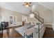 Inviting living room with large sofa, fireplace, and stairs to the second level at 320 Rossiter Rdg, Alpharetta, GA 30022