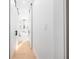 Bathroom hallway with sliding barn doors leading to a freestanding tub at 9770 Coleman Rd, Roswell, GA 30075