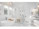 Bright bathroom features a soaking tub, glass shower, and marble floors at 9770 Coleman Rd, Roswell, GA 30075