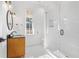 Contemporary bathroom with glass shower, patterned floor, and wooden vanity at 9770 Coleman Rd, Roswell, GA 30075