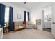 Bedroom features a crib and a sitting area at 9770 Coleman Rd, Roswell, GA 30075