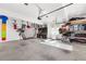 Spacious and well-organized garage with ample storage, shelving, and workspace for various activities at 9770 Coleman Rd, Roswell, GA 30075