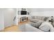 Living room with a sectional sofa and a TV at 9770 Coleman Rd, Roswell, GA 30075
