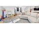 Playroom with a sectional sofa and toys at 9770 Coleman Rd, Roswell, GA 30075