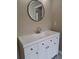 Bathroom vanity with a sink, mirror, and a door in the background at 1356 Ambercrest Way, Austell, GA 30168