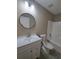 Full bathroom with new vanity, sink, and a modern round mirror at 1356 Ambercrest Way, Austell, GA 30168