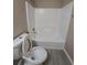 Full bathroom featuring a white shower and toilet at 1356 Ambercrest Way, Austell, GA 30168