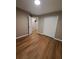Bedroom featuring wood flooring, a closet with white doors, and an open doorway at 1356 Ambercrest Way, Austell, GA 30168