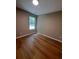 Cozy bedroom with wood-look floors and a bright window to enhance the natural light at 1356 Ambercrest Way, Austell, GA 30168