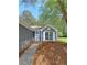 Charming single-story home with gray siding, white trim and a well-landscaped front yard at 1356 Ambercrest Way, Austell, GA 30168