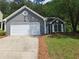 Charming single-Gathering home features a two-car garage and well-maintained lawn at 1356 Ambercrest Way, Austell, GA 30168
