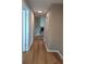 Hallway features wood-look flooring and leads to the living area with a fireplace at 1356 Ambercrest Way, Austell, GA 30168