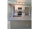Eat-in kitchen island with granite countertop, stainless steel sink and black hardware at 1356 Ambercrest Way, Austell, GA 30168