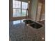 Kitchen island with stainless steel sink, faucet and granite countertops at 1356 Ambercrest Way, Austell, GA 30168