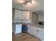 Bright kitchen with white cabinets, granite countertops, and stainless steel appliances at 1356 Ambercrest Way, Austell, GA 30168