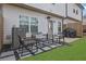 Cozy back patio with stylish furniture, stone accents, and an inviting outdoor space at 1386 Ben Park Way, Grayson, GA 30017