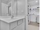 Bathroom sink that leads into a laundry room with a white washer and dryer at 1386 Ben Park Way, Grayson, GA 30017