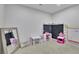Creative playroom featuring chalkboard corner, craft area, and plenty of space for activities at 1386 Ben Park Way, Grayson, GA 30017