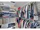 Organized walk-in closet featuring custom shelving and ample storage for clothing and accessories at 1386 Ben Park Way, Grayson, GA 30017