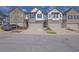 Charming townhomes featuring brick and siding exteriors, attached garages, and well-maintained landscaping at 1386 Ben Park Way, Grayson, GA 30017