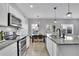 Bright, well-equipped kitchen with granite countertops, stainless steel appliances and a breakfast nook nearby at 1386 Ben Park Way, Grayson, GA 30017