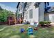 The spacious backyard features a deck, patio, lush lawn, and playsets at 2604 Porchside Se Pl, Atlanta, GA 30316