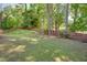 A large, grassy backyard enclosed by a wood fence, providing privacy and space for outdoor activities at 2604 Porchside Se Pl, Atlanta, GA 30316
