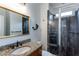 Modern bathroom with a glass-enclosed shower, granite countertop vanity, and stylish fixtures at 2604 Porchside Se Pl, Atlanta, GA 30316