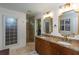Elegant bathroom with double vanity, granite countertops, walk-in shower, and tasteful design at 2604 Porchside Se Pl, Atlanta, GA 30316