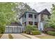 Charming two-story home with a two-car garage, inviting porch, and mature landscaping at 2604 Porchside Se Pl, Atlanta, GA 30316