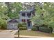 Charming two-story home boasts a welcoming front porch and lush landscaping in a serene, tree-lined neighborhood at 2604 Porchside Se Pl, Atlanta, GA 30316