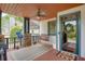 Inviting covered front porch with swing, ceiling fan, and stylish welcome mat at 2604 Porchside Se Pl, Atlanta, GA 30316