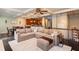 Inviting living room with modern decor, coffered ceilings, an open floor plan, and a comfortable sectional sofa at 2604 Porchside Se Pl, Atlanta, GA 30316
