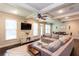 Bright living room featuring a large sectional sofa and coffered ceilings at 2604 Porchside Se Pl, Atlanta, GA 30316