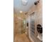 Spacious tiled shower with dual shower heads, glass door, bench, and a glass block window at 2604 Porchside Se Pl, Atlanta, GA 30316