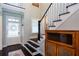 Staircase leading to the upper level with dark wood steps and white door at 2604 Porchside Se Pl, Atlanta, GA 30316